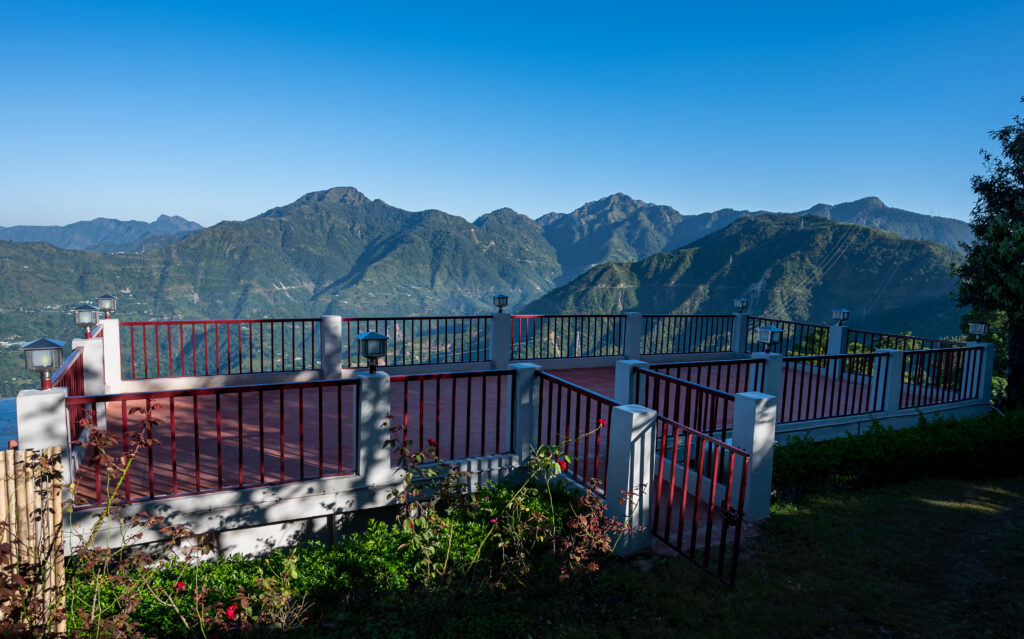 A safety railing to take a mountain view