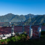 A safety railing to take a mountain view